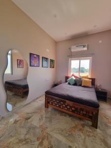 Postel nebo postele na pokoji v ubytování Pink Villa Mamallapuram + 18 fotografií
