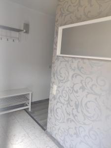 a room with a wall with a large mirror at 64747 Breuberg Odenwald 2 Schlafzimmer in Breuberg