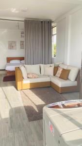 a living room with a couch and a bed at Tranquile Viwe in Gonapinuwala West