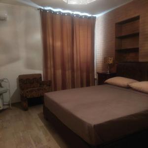 Un pat sau paturi într-o cameră la Villa Fiorenza