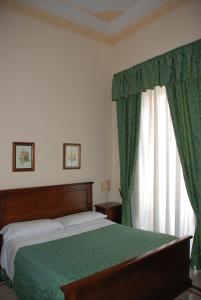 Postel nebo postele na pokoji v ubytování Hotel del Centro