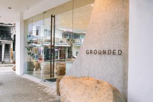 a store front with the word groundchecked on the side of a building at S Resort El Nido Managed by H Hospitality Group - Newly Renovated in El Nido +52 photos