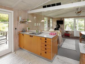 a kitchen with a sink and a counter top at 4 person holiday home in Højslev in Højslev
