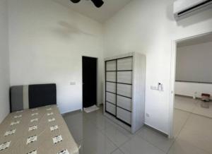 a large white room with a bed in it at XQ Homestay Eco Borough in Nusajaya
