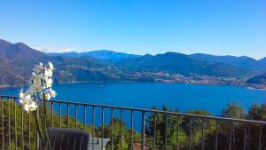 a view of a lake from a balcony at Perla del Lago in Carmine