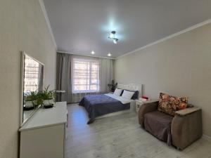 Postel nebo postele na pokoji v ubytování Евродвушка Аэропорт-жк Будапешт