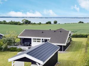 an overhead view of a house with a view of the water at 4 star holiday home in Svendborg in Svendborg