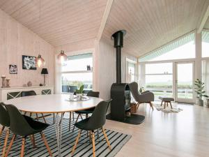 a dining room with a table and chairs at 4 star holiday home in Svendborg in Svendborg