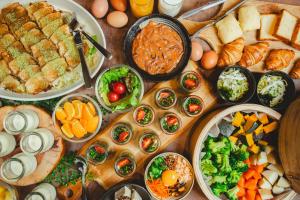 a table with many different types of food on it at Hotel La'gent Plaza Hakodate Hokuto in Hokuto