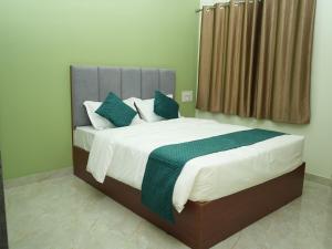 Ένα ή περισσότερα κρεβάτια σε δωμάτιο στο Serene Legacy