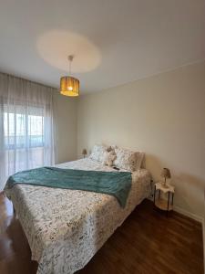 a bedroom with a bed with a teddy bear on it at Serene Coastal Retreat with king Beds & Pool in Lavra in Lavra +34 photos