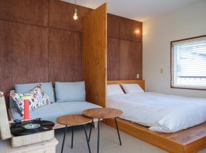 Ένα ή περισσότερα κρεβάτια σε δωμάτιο στο guesthouse YAWNYAWN