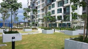 a large apartment building with a park in front of it at Setapak Central Mall KL - Zetapark Garden Suites in Kuala Lumpur