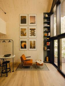 a living room with a table and a chair at Green View Tornow in Tornow