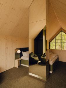 a small room with a bed and a window at Green View Tornow in Tornow