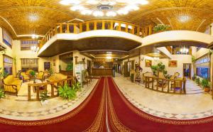 a large lobby with a red carpet in a building at Baglar Saray Hotel in Safranbolu