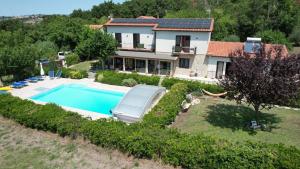 an aerial view of a house with a swimming pool at Cà RosannA in Rocca San Felice
