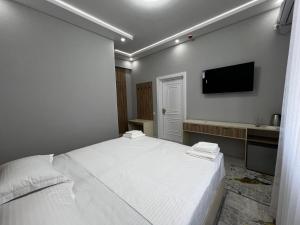 Et tv og/eller underholdning på Hotel Zafarbek Plaza