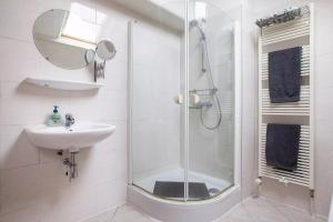 a bathroom with a shower and a sink at Family rooms in central, historic Gouda in Gouda