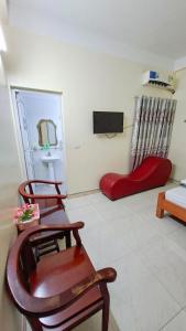 Μια τηλεόραση ή/και κέντρο ψυχαγωγίας στο Nhà Nghỉ Đức Anh2