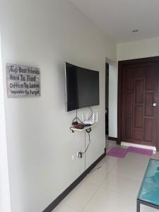 a wall with a flat screen tv on a wall at Private Luxury Poolvilla, Koh Chang in Ban Dan Mai