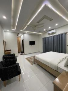 Ένα ή περισσότερα κρεβάτια σε δωμάτιο στο Zainab Lodges