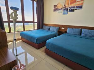 Postel nebo postele na pokoji v ubytování Bali Residence Waterpark Executive Suites Melaka By GGM