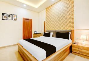 a bedroom with a large bed in a room at Prem villas homestay in Tājganj +11 photos