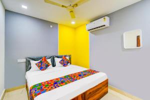 Ένα ή περισσότερα κρεβάτια σε δωμάτιο στο FabHotel R3 Atmos