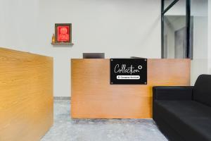 a waiting room with a sign on the wall at Collection O Talwade in Pune