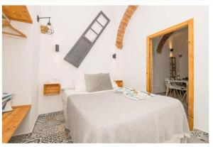 Ένα ή περισσότερα κρεβάτια σε δωμάτιο στο Casa Cuna