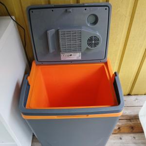 an orange and black cooler with a radio on top at Tottes Resort in Kolmården