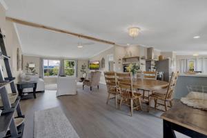 a kitchen and living room with a table and chairs at Sage: Peaceful Hill Country Retreat with Hot-Tub! in Morris Ranch