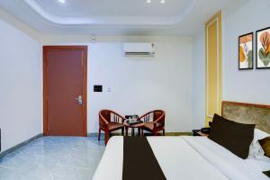 Posezení v ubytování Super Hotel O Expo Mart Ansal Golf Link 1