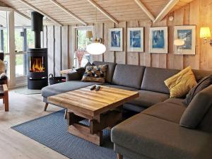 a living room with a couch and a coffee table at Luxury Spa Retreat by Sea - By Traum Ferienwohnungen in Trudslev +22 photos
