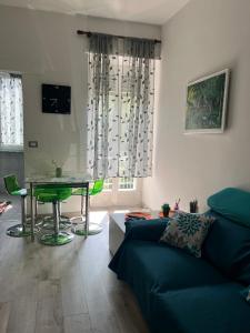 a living room with a couch and a table at Casa Camilla in Banchette
