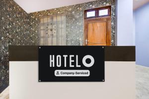 a sign for a hotel in front of a door at Super OYO Hotel O Amhat Sultanpur City in Sultānpur +46 photos