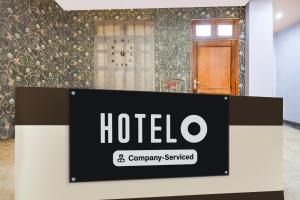 a hotel sign in front of a room at Super OYO Hotel O Amhat Sultanpur City in Sultānpur