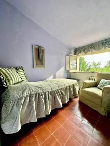 Ένα ή περισσότερα κρεβάτια σε δωμάτιο στο Casale Novilara