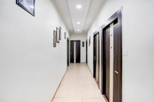 a corridor in a hotel with doors at Townhouse Faizabad Road Opp BBD University in Lucknow