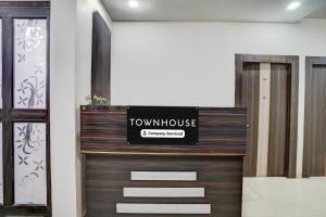a front door of a town house with a sign on it at Townhouse Faizabad Road Opp BBD University in Lucknow