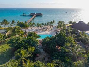 an aerial view of a resort with a pool and the ocean at Aldiana Club Zanzibar Kwanza in Kizimkazi