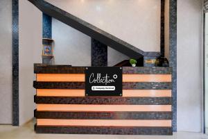 a display case for a coffee shop with a black sign at Super Collection O SRS Residency in Shillong