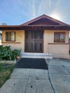 a house with a large door and a driveway at Entire Front House in Los Angeles in Los Angeles
