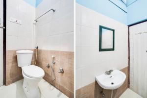 a bathroom with a toilet and a sink at Super Hotel O Vaishali Nagar in Jaipur +23 photos