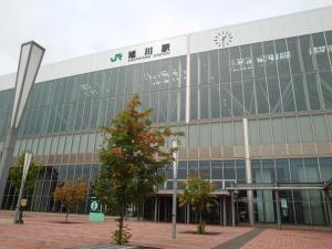 a large building with a clock on the side of it at HOTEL TETORA ASAHIKAWA EKIMAE - Vacation STAY 91497v in Asahikawa