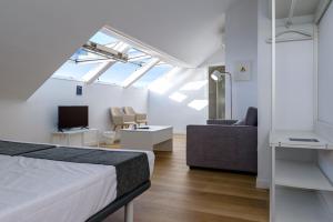 Télévision ou salle de divertissement dans l'établissement Alda Corrubedo