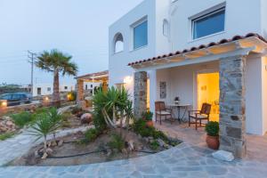 a villa with a view of the patio of a house at Villa Lena in Stelida