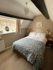 En eller flere senge i et værelse på Endways Cottage + 14 billeder