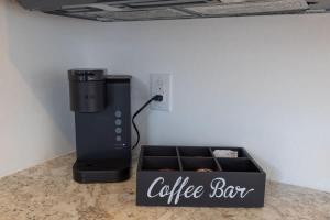 a coffee box sitting on a counter next to a coffee maker at Resort at Fredericksburg Unit 24 in Rocky Hill